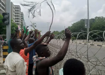 Protesters occupy Abuja Federal Secretariat Complex as military fire teargas