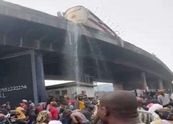 Residents warned to stop scooping diesel from  fallen tanker