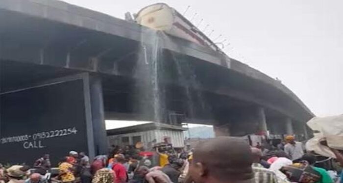 Residents warned to stop scooping diesel from  fallen tanker