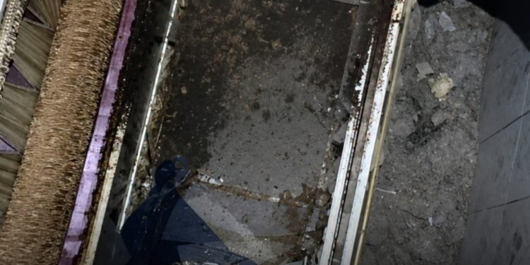 Pastor goes into hiding after body found buried in church